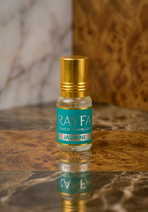 Jasmine attar fragrance oil bottle with gold cap and blue label