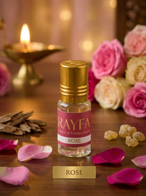 Rose attar perfume bottle with gold cap and pink rose label, clear glass vial