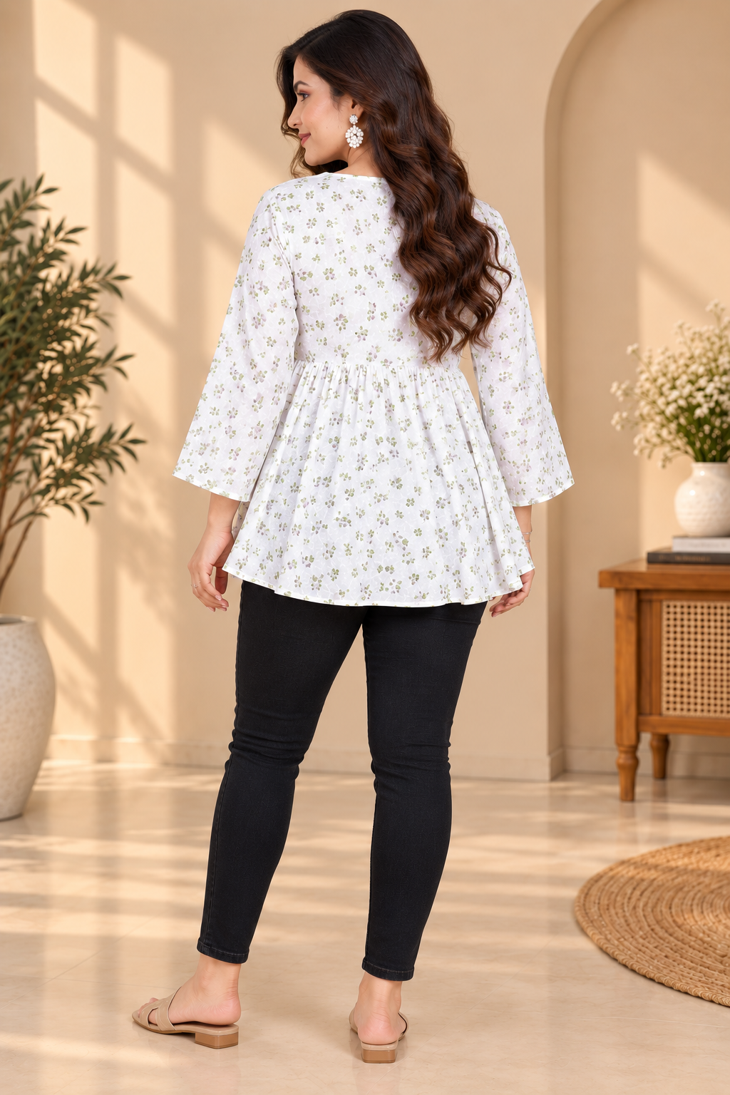 Back view of white short kurti with green floral print and flared gathered skirt