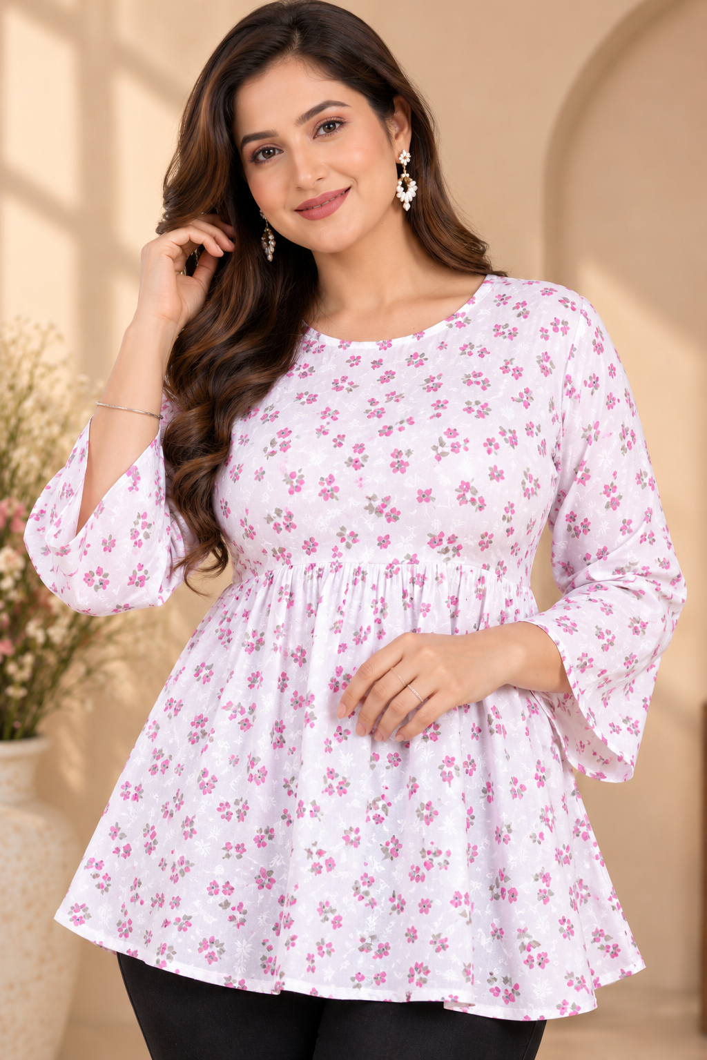 White floral printed short kurti with pink accents, three-quarter flared sleeves